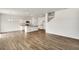Open concept kitchen with island and hardwood floors at 13547 Valentia St, Thornton, CO 80602