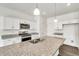 Modern kitchen with white cabinets and granite countertops at 13547 Valentia St, Thornton, CO 80602