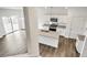 Modern kitchen with granite countertops and island at 13547 Valentia St, Thornton, CO 80602
