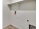 Laundry room with shelving and flooring at 13547 Valentia St, Thornton, CO 80602