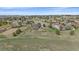Aerial view of blue house with large lot, open space, and suburban neighborhood at 21166 E Euclid Dr, Centennial, CO 80016