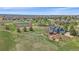 Aerial view of blue house with large lot, open space, tennis courts and neighborhood at 21166 E Euclid Dr, Centennial, CO 80016