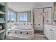 Lovely bathroom with a glass shower and large tub by the window at 21166 E Euclid Dr, Centennial, CO 80016