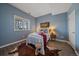 Comfortable bedroom with a window, a view of nature, and stylish decor at 21166 E Euclid Dr, Centennial, CO 80016