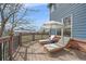 A wooden deck with patio chairs and a side table offers great views at 21166 E Euclid Dr, Centennial, CO 80016