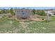 A beautiful two-story home with a large yard and mature trees on a sunny day at 21166 E Euclid Dr, Centennial, CO 80016