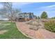 Exterior of blue two-story home with deck and landscaped yard at 21166 E Euclid Dr, Centennial, CO 80016