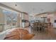 Well-lit kitchen features a center island with bar seating, stainless steel appliances, and access to an outdoor deck at 21166 E Euclid Dr, Centennial, CO 80016
