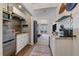 Convenient kitchenette featuring stainless steel appliances and attractive backsplash at 21166 E Euclid Dr, Centennial, CO 80016