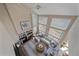 Sunlit living room with fireplace, large windows, and comfortable sectional seating at 21166 E Euclid Dr, Centennial, CO 80016