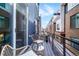 Cozy balcony with stylish seating, perfect for outdoor relaxation with a view of the neighborhood at 3050 Wilson Ct # 1, Denver, CO 80205