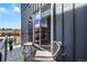 Cozy balcony with stylish seating, perfect for outdoor relaxation with a view of the neighborhood at 3050 Wilson Ct # 1, Denver, CO 80205