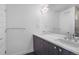 Clean bathroom featuring double sinks, sleek cabinetry, a large mirror, and modern fixtures at 3050 Wilson Ct # 1, Denver, CO 80205