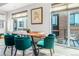 Dining room with modern table, velvet chairs, and access to an outdoor patio at 3050 Wilson Ct # 1, Denver, CO 80205