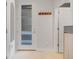 Bright entryway with a frosted glass door, coat rack, and neutral decor at 3050 Wilson Ct # 1, Denver, CO 80205