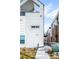 View of the side exterior of a modern townhome featuring a balcony and contemporary design at 3050 Wilson Ct # 1, Denver, CO 80205