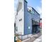Stylish townhome exterior showcasing sleek metal siding, a private balcony, and contemporary architectural details at 3050 Wilson Ct # 1, Denver, CO 80205