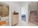 Hallway view with a bathroom, bedroom and stairs with colorful tile risers at 3050 Wilson Ct # 1, Denver, CO 80205
