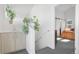 Hallway featuring sink with cabinets and view into bedroom with barn door at 3050 Wilson Ct # 1, Denver, CO 80205