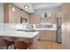 Modern kitchen with stainless steel appliances, quartz countertops, and wooden cabinets at 3050 Wilson Ct # 1, Denver, CO 80205