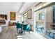 Open concept living and dining area with hardwood floors and access to an outdoor patio at 3050 Wilson Ct # 1, Denver, CO 80205