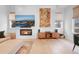 Bright living area with fireplace, TV, modern decor, and plenty of natural light at 3050 Wilson Ct # 1, Denver, CO 80205