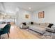 Open concept living and dining area with hardwood floors and modern decor at 3050 Wilson Ct # 1, Denver, CO 80205