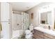 Well-appointed bathroom featuring a shower-tub combination and stylish vanity at 7256 Aspen Meadow Dr, Evergreen, CO 80439