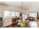 Bright dining area with hardwood floors and windows with a view at 7256 Aspen Meadow Dr, Evergreen, CO 80439