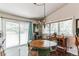 Inviting dining area with natural light and views of the surrounding landscape at 7256 Aspen Meadow Dr, Evergreen, CO 80439