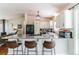 Bright kitchen featuring stainless appliances, bar seating, and an open layout at 7256 Aspen Meadow Dr, Evergreen, CO 80439
