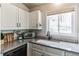 Bright kitchen featuring stainless appliances and sleek countertops at 7256 Aspen Meadow Dr, Evergreen, CO 80439