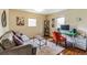 Inviting office space with a sofa, sleek desk setup, and ample natural light, perfect for productivity at 7256 Aspen Meadow Dr, Evergreen, CO 80439
