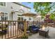 Backyard featuring a deck, patio, and a fire pit with seating at 6471 S Potomac Ct, Englewood, CO 80111