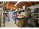 Basement storage area with shelving and exposed ceiling at 6471 S Potomac Ct, Englewood, CO 80111