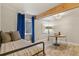 Calm bedroom featuring hardwood floors, exposed beam, natural light, and a compact dining area at 6471 S Potomac Ct, Englewood, CO 80111