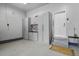 Garage with built-in cabinets and access door at 6471 S Potomac Ct, Englewood, CO 80111