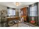 Charming office space with hardwood floors, chandelier, and antique wooden cabinet at 6471 S Potomac Ct, Englewood, CO 80111