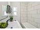Modern bathroom featuring a sleek sink, decorative accents and tiled shower at 2230 Niagara St, Denver, CO 80207