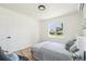 Cozy bedroom with a comfortable bed, hardwood floors and bright window light at 2230 Niagara St, Denver, CO 80207
