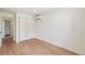 Spacious bedroom with hardwood flooring and a large closet with sliding doors at 2230 Niagara St, Denver, CO 80207