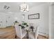 Cozy dining area with a glass table set, upholstered chairs, and an ornate accent piece on the wall at 2230 Niagara St, Denver, CO 80207
