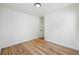 An empty bedroom featuring hardwood floors, bright window light, and neutral decor at 2230 Niagara St, Denver, CO 80207