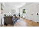Bright living room featuring hardwood floors, stylish furniture, and a decorative wall accent at 2230 Niagara St, Denver, CO 80207