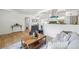 Cozy living space featuring hardwood floors, white walls, a modern coffee table and a comfortable gray sofa at 2230 Niagara St, Denver, CO 80207