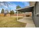 View of large fenced backyard with a covered patio perfect for outdoor living at 5345 E Thrill Pl, Denver, CO 80207