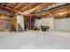 Spacious unfinished basement offering potential for customization and storage at 570 Clarendon Loop, Castle Pines, CO 80108