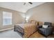 Cozy bedroom with vaulted ceiling features a metal frame bed and neutral color scheme at 570 Clarendon Loop, Castle Pines, CO 80108