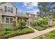 Charming townhome exterior featuring stone accents, lush landscaping, and inviting curb appeal at 570 Clarendon Loop, Castle Pines, CO 80108