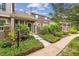 Charming exterior view of home with well-manicured landscaping, stone accents, and inviting curb appeal at 570 Clarendon Loop, Castle Pines, CO 80108